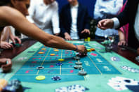 People playing blackjack at the casino table