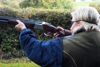 A woman clay pigeon shooting