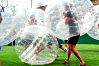 Men playing Zorb football