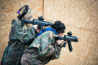 two women playing laser mission tag