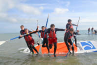 Stag group jumping off a paddleboard