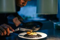 Time Out Market Lisbon cook finishing gourmet meal