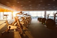 modern indoor gym equipment with sunset