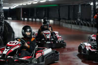 mixed group doing indoor go karting chilli