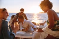 friends having fun and drinks on boat party