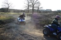 a group riding around a quad bike track