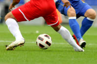 A group of men playing football