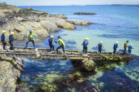 A group of girls doing coasteering