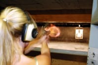 A woman at a shooting range