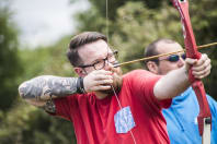 A man shooting an arrow in archery