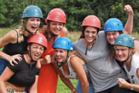 A happy smiling hen group celebrate winning highland games