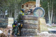 A group of people enjoying a game of paintball