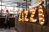 a zizzi restaurant with sign