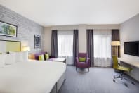 Jurys Inn Manchester Double Bedroom with sofa.jpg