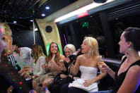Women having fun on a party bus