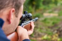 A man shoots an air rifle