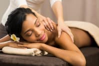 a woman receiving a massage during pampering session