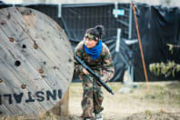 A woman playing airsoft