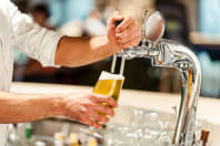 Beer pouring from a tap