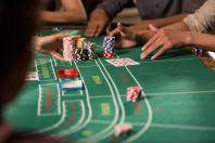 People playing blackjack at the casino table