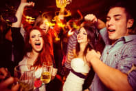 A happy group partying in a bar, bar crawling