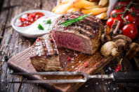 A plate of steak and chips