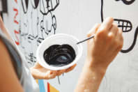 artist painting street wall