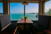 St Christophers Inn Newquay  - bar table and beach