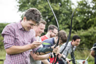 A stag group doing archery