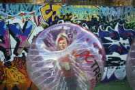 A woman playing bubble football