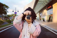 Girl Taking Photograph