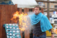 A man on a stag weekend breathing fire
