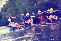 A group of guys who have built their own raft