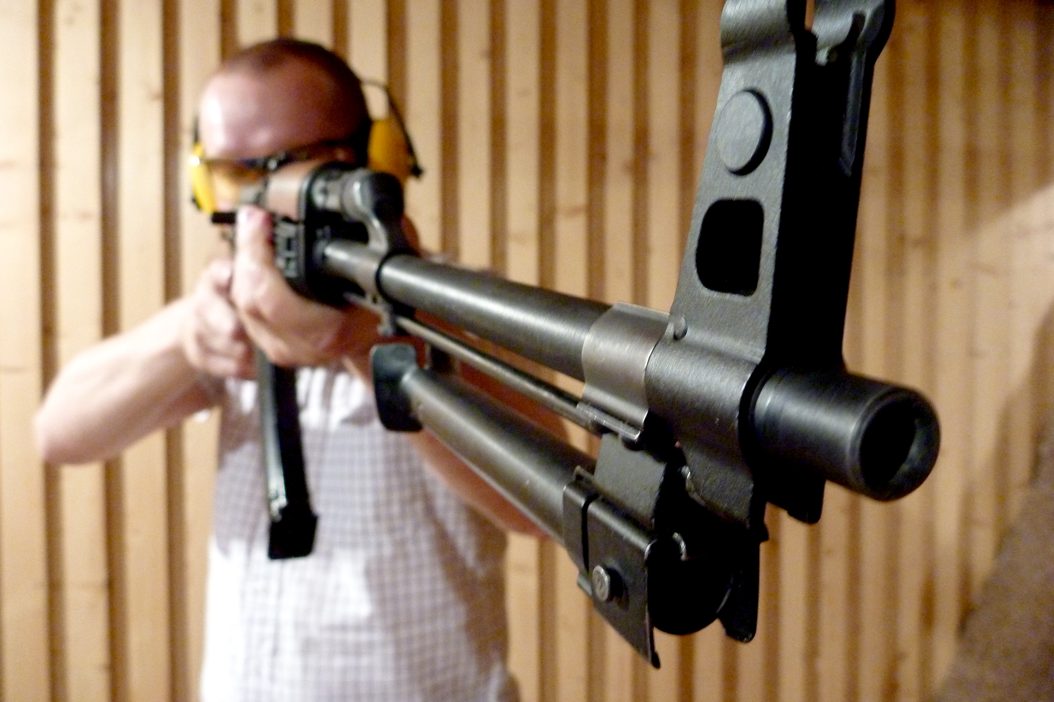A man holding a large gun