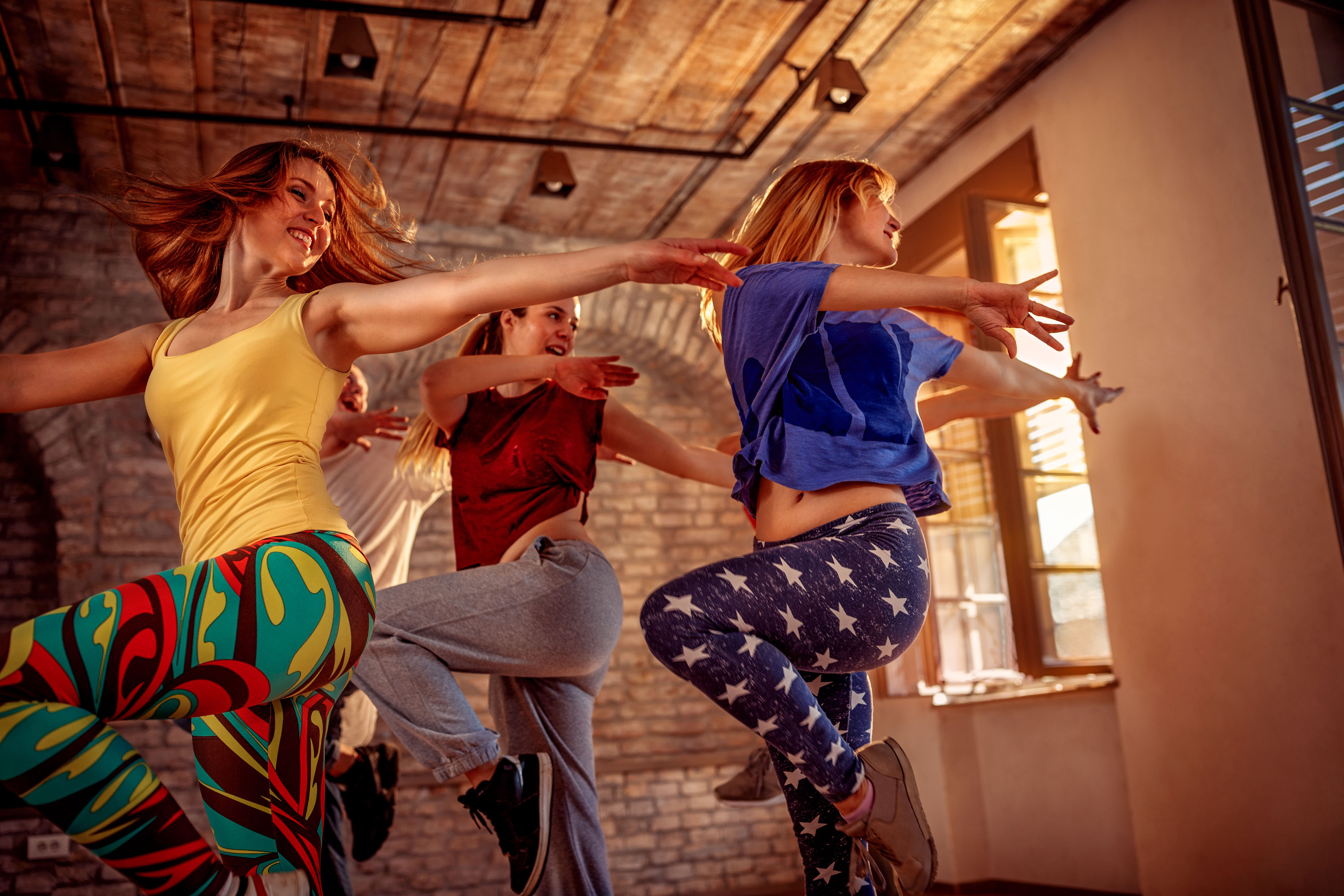 women dancing in studio dance class retro theme hens having fun together