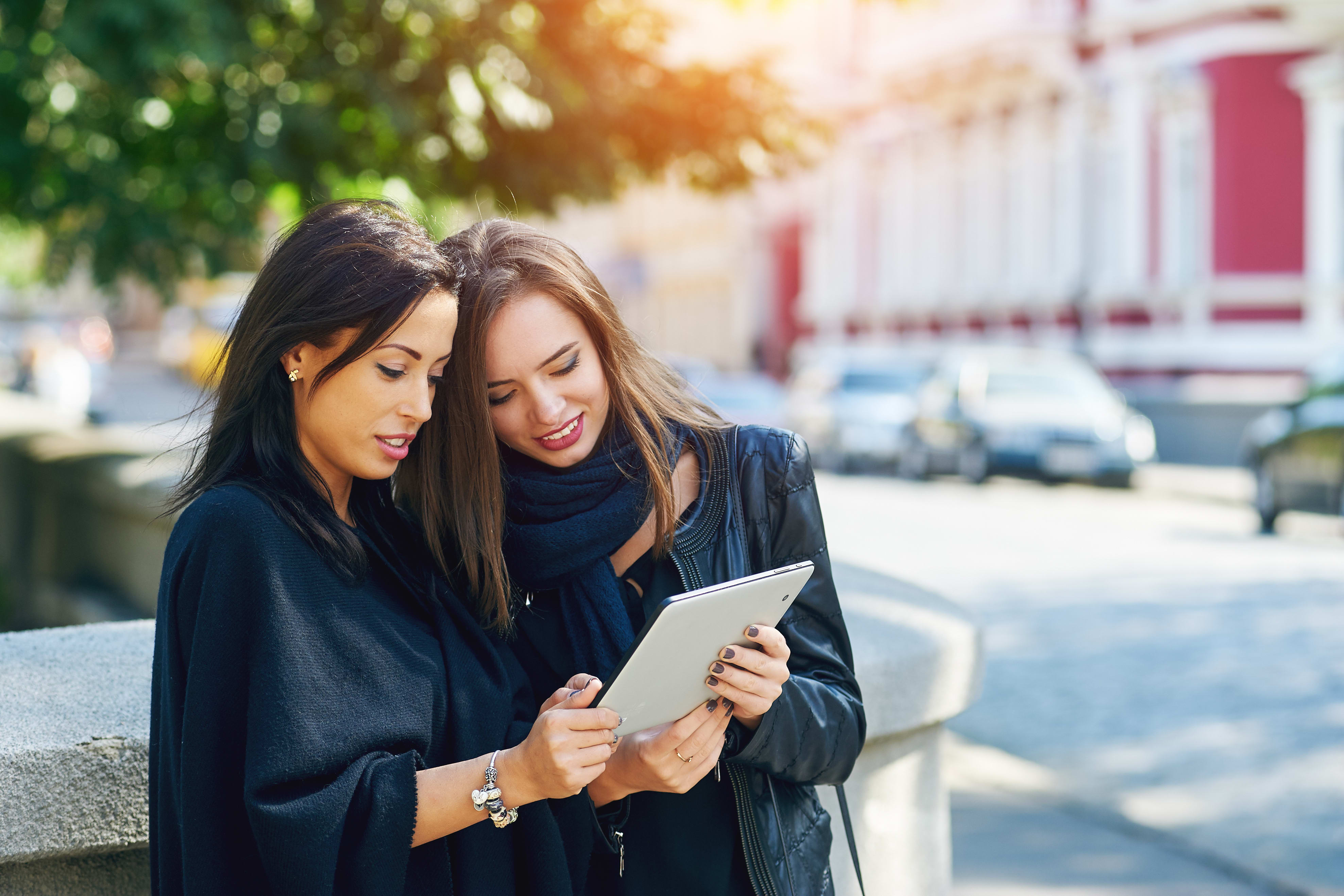 women looking at ipad