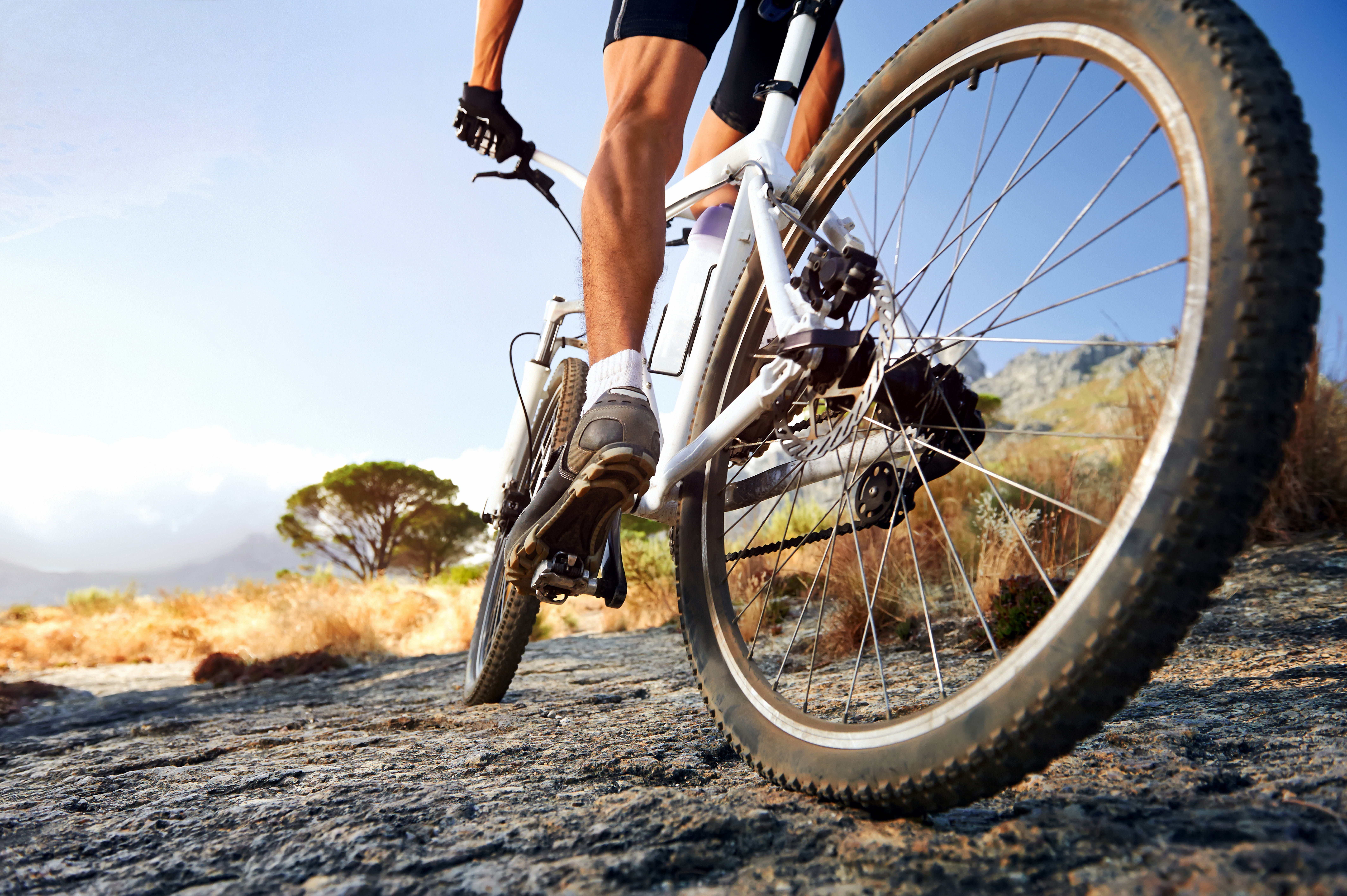 Man riding along a path on a mountain bike
