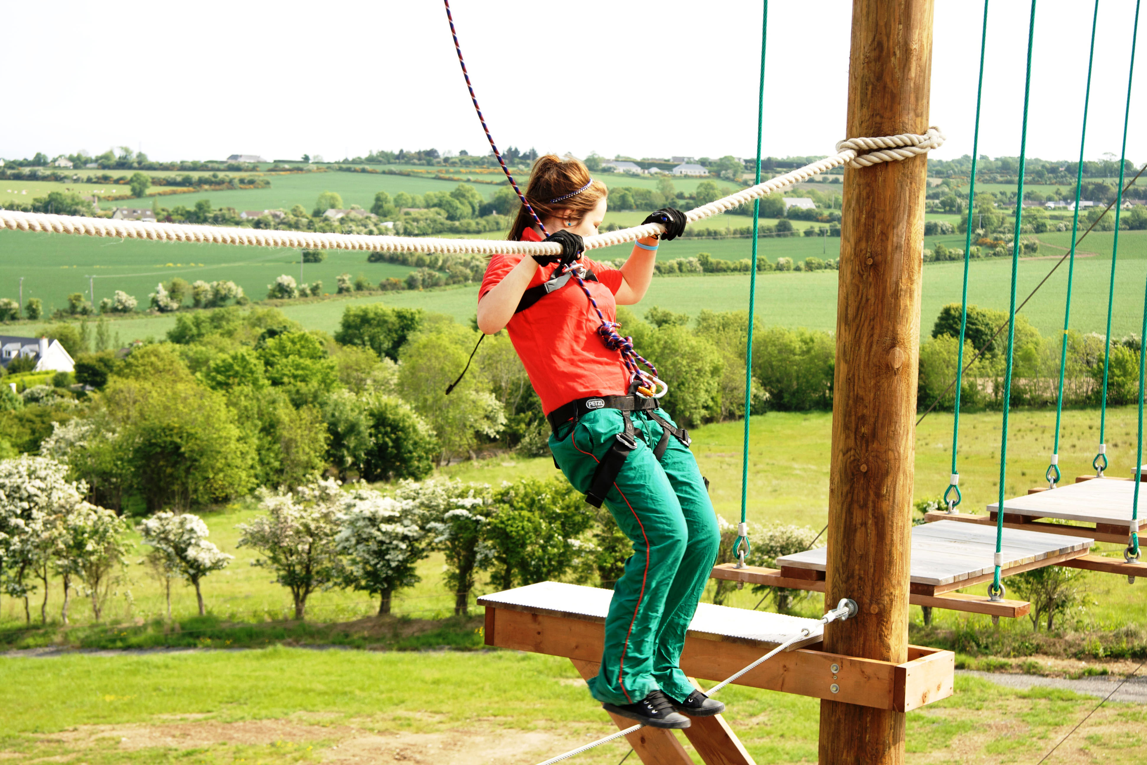 A woman on a high ropes course