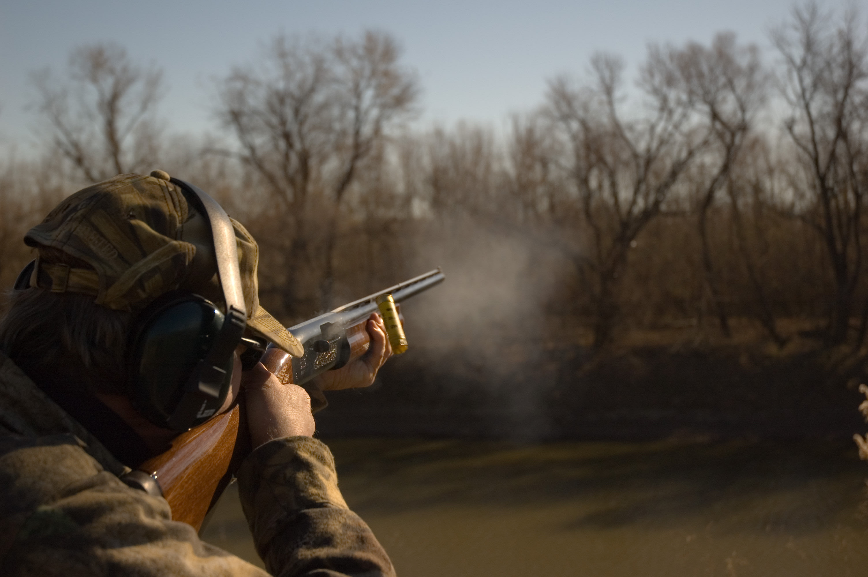 Man shooting gun during clay pigeon event