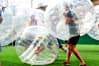 Men playing Zorb football