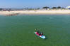 A group of men on a jumbo paddleboard