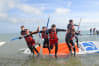 Stag group jumping off a paddleboard