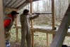A man aims a shotgun dring clay pigeon shooting