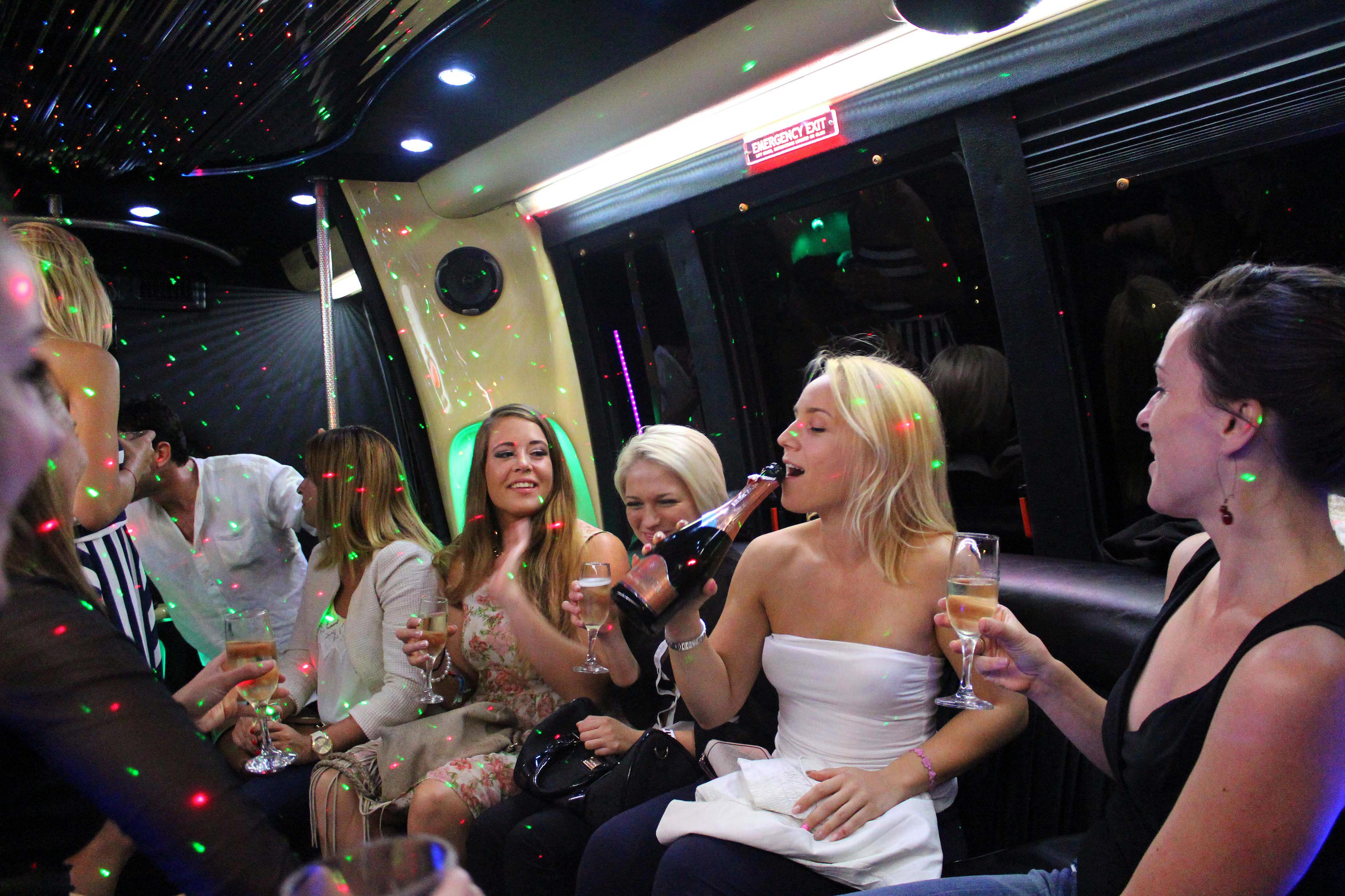 Women having fun on a party bus