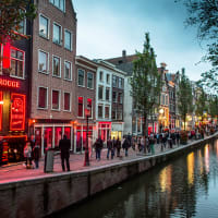 Amsterdam canal showing nightlife in the evening