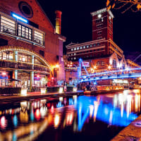 A busy brightly lit canal in Birmingham