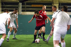 A stag group play five-a-side football