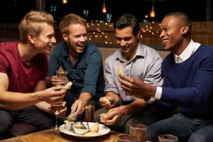Group of guys sharing platter