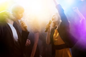 Lip Sync Battle karaoke friends dancing in busy venue