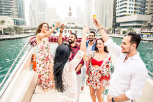 friends enjoying drinks and private yatch in Dubai